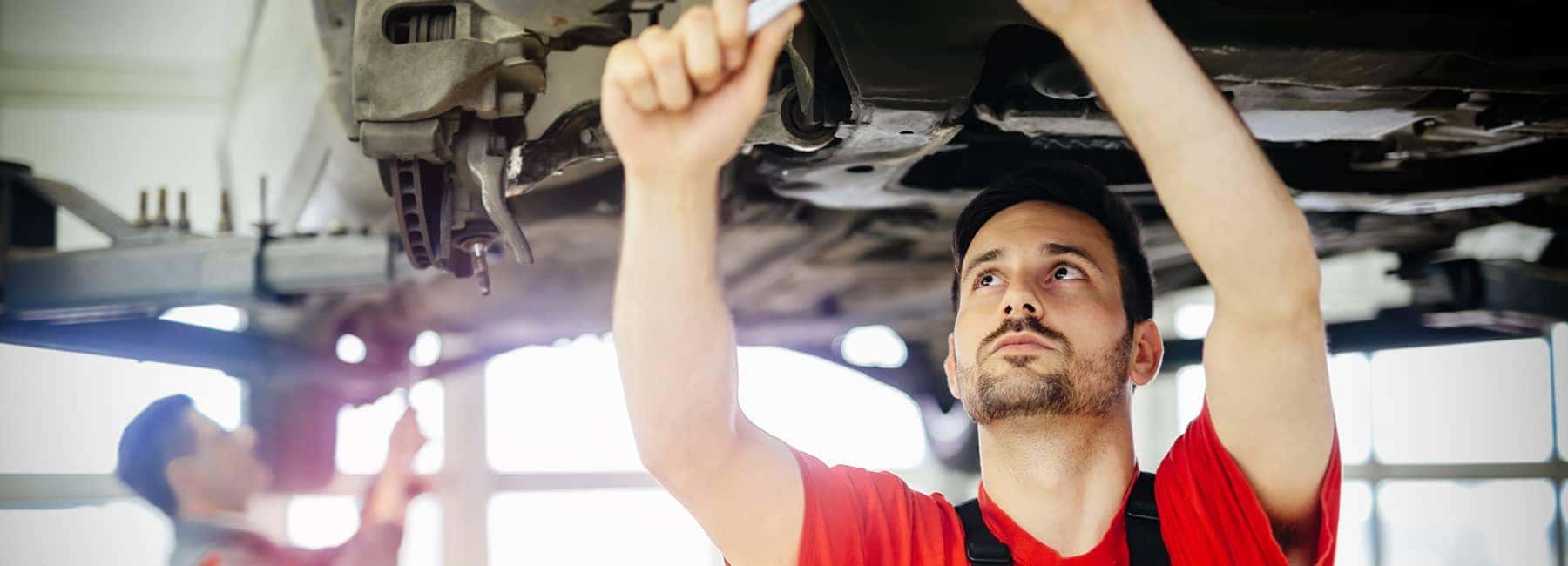 Service mechanic under car