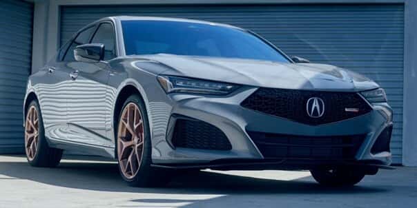 2025-Acura-TLX-parked-in-front-of-metal-storage-doors
