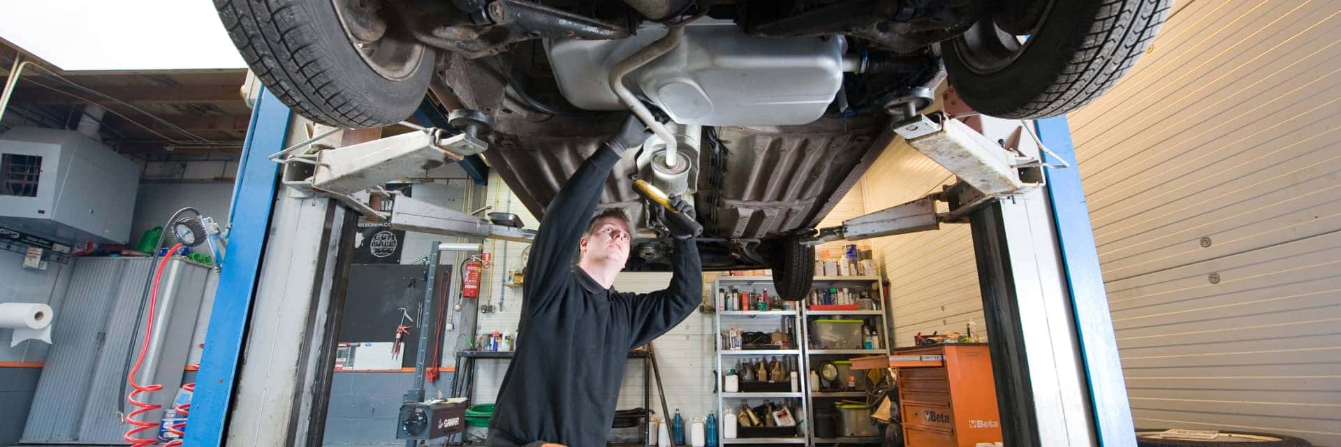 service-specialist-looking-at-undercarriage