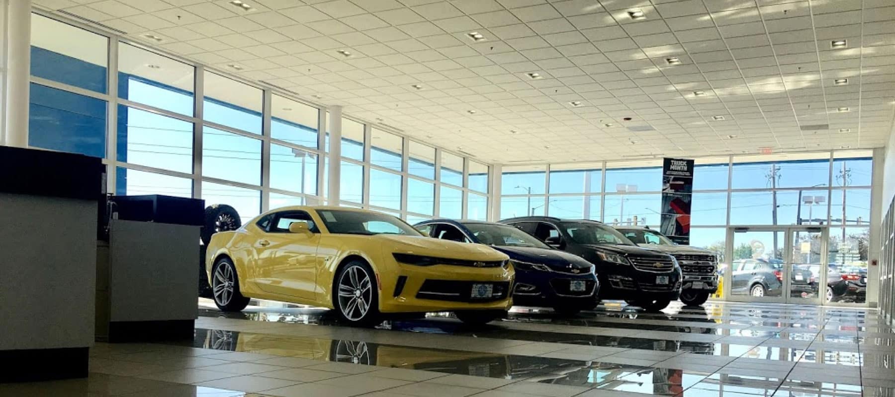 Line of cars in dealership