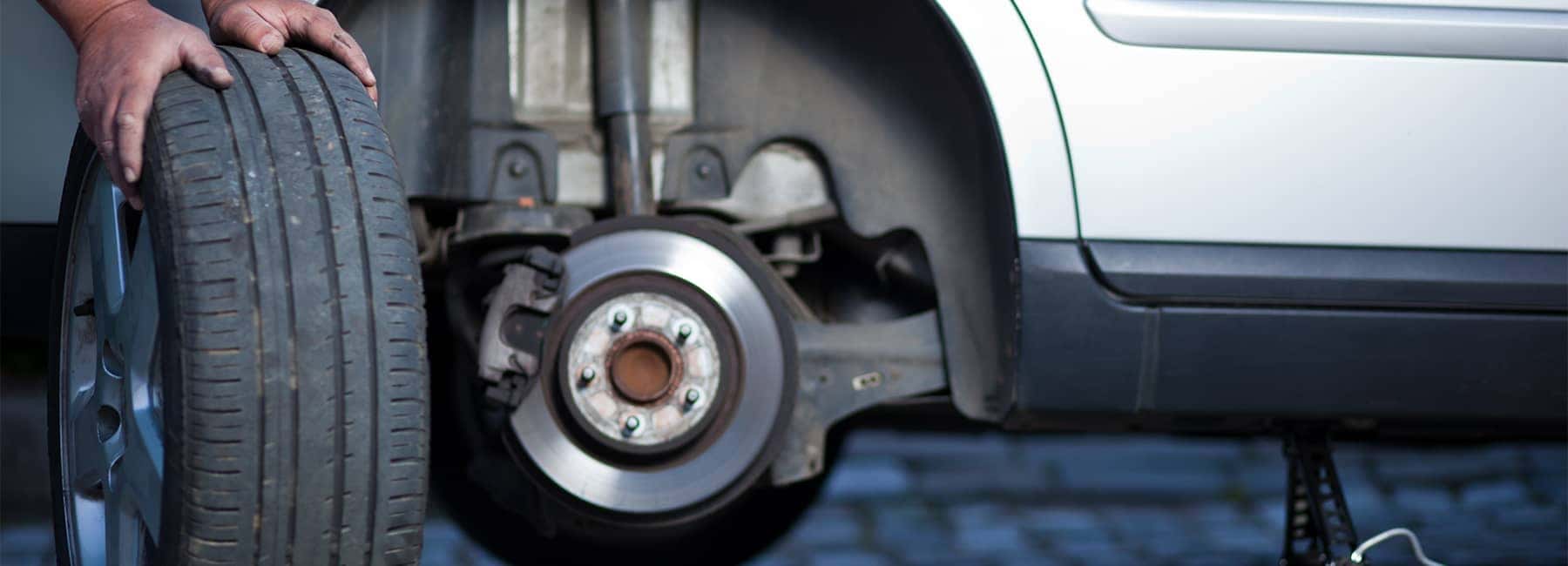 Mechanic-changing-a-wheel-of-a-modern-car