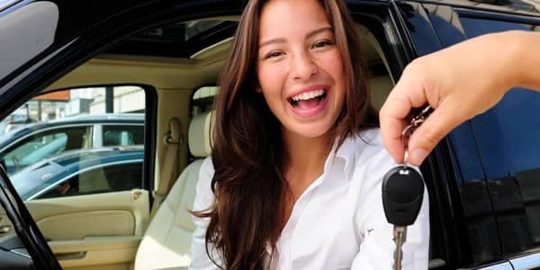 Dealer Financing - An Exuberent young Women get new car keys