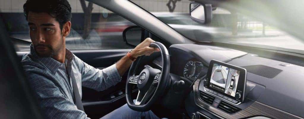 Man driving in Nissan Altima