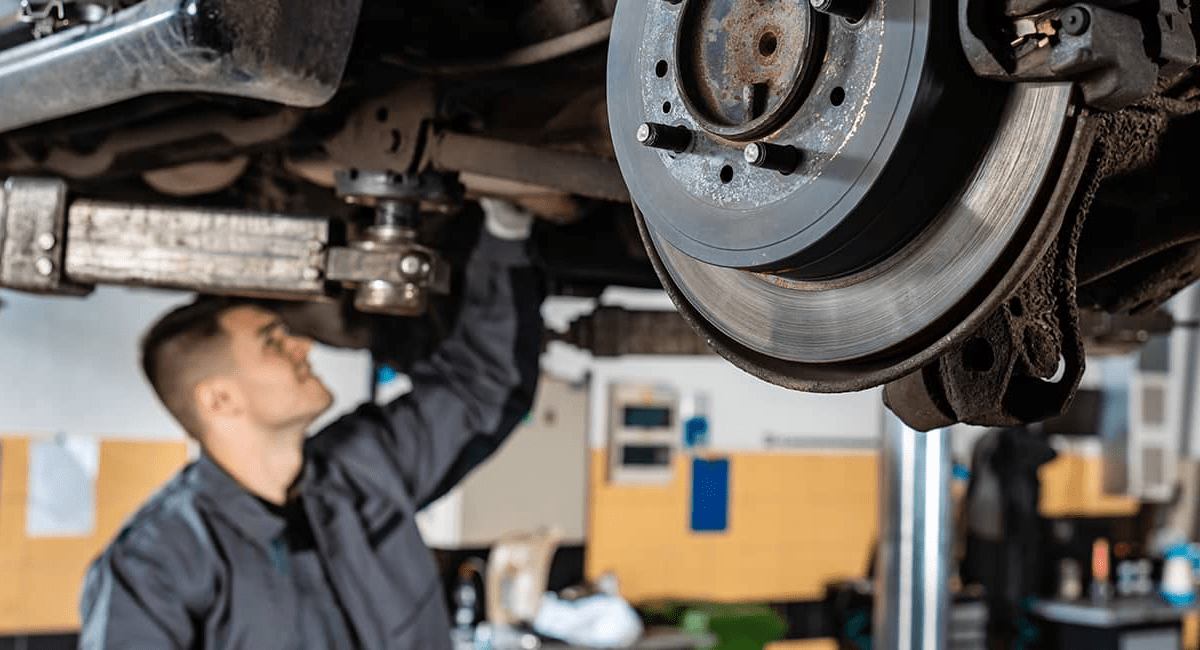 mechanic-repairs-car-brakes