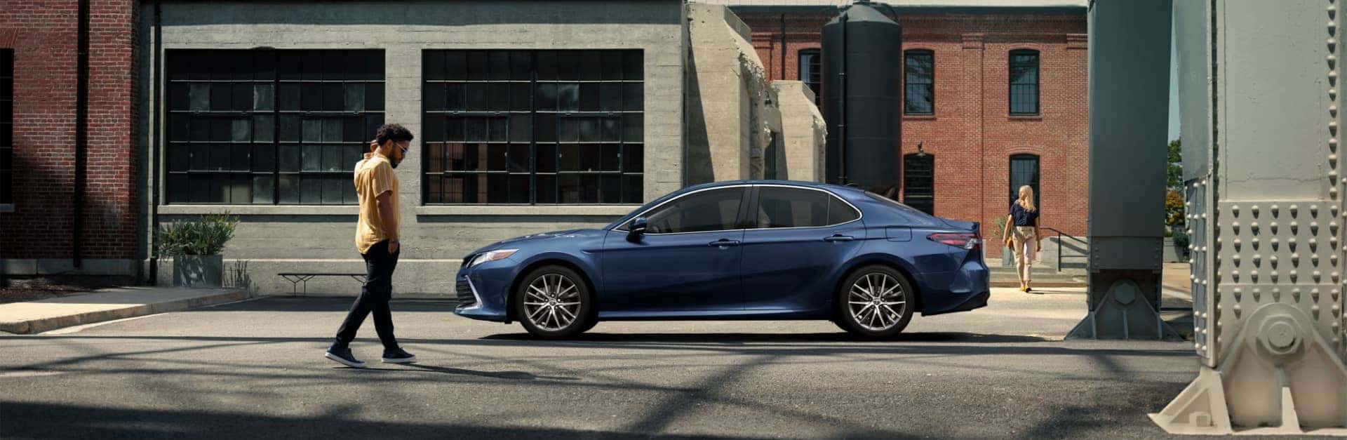Toyota sedan parked on a downtown street.