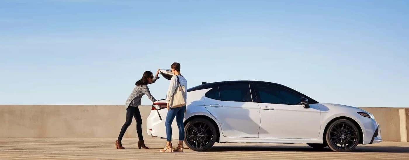 A white 2022 Toyota Camry XSE is shown from the side after leaving a Virginia Toyota dealer.