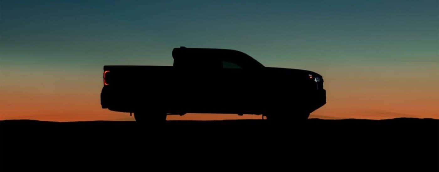 A popular Toyota Tacoma for Sale Near Manchester, VA, a black 2024 Toyota Tacoma is shown in silhouette.