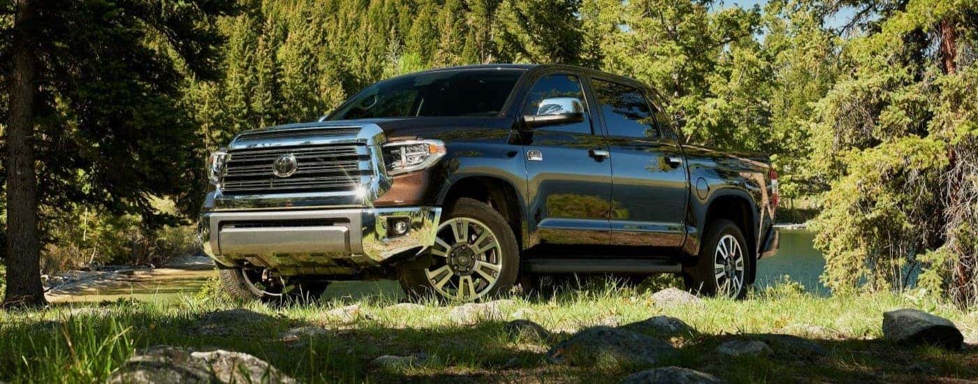 A brown 2021 Toyota Tundra is shown parked near a lake.