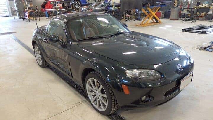 Mazda convertible before shot with car body damage