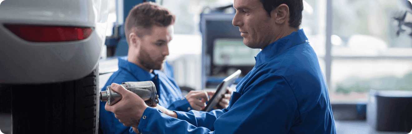 Technicians working on a vehicle