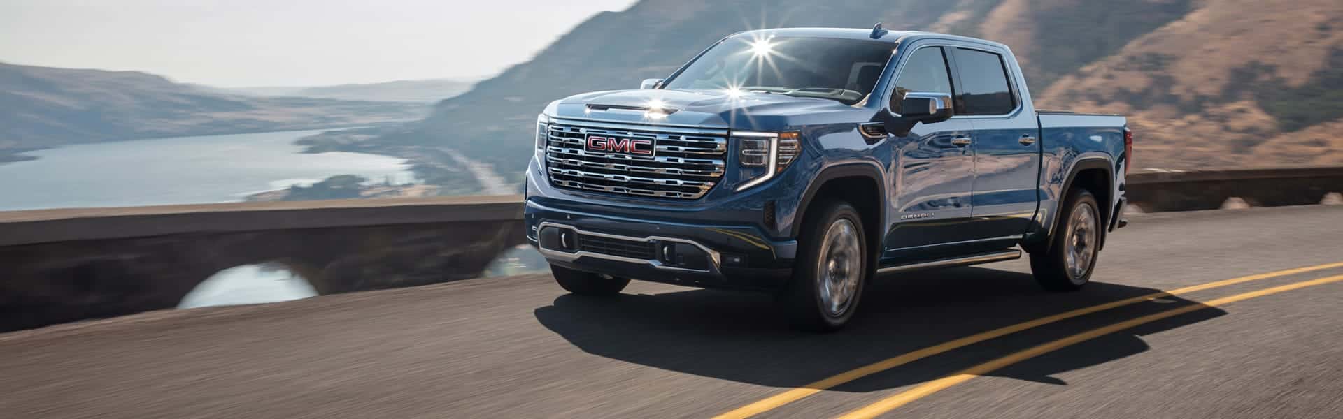 2025-GMC-Sierra-1500-driving-on-a-coastal-highway