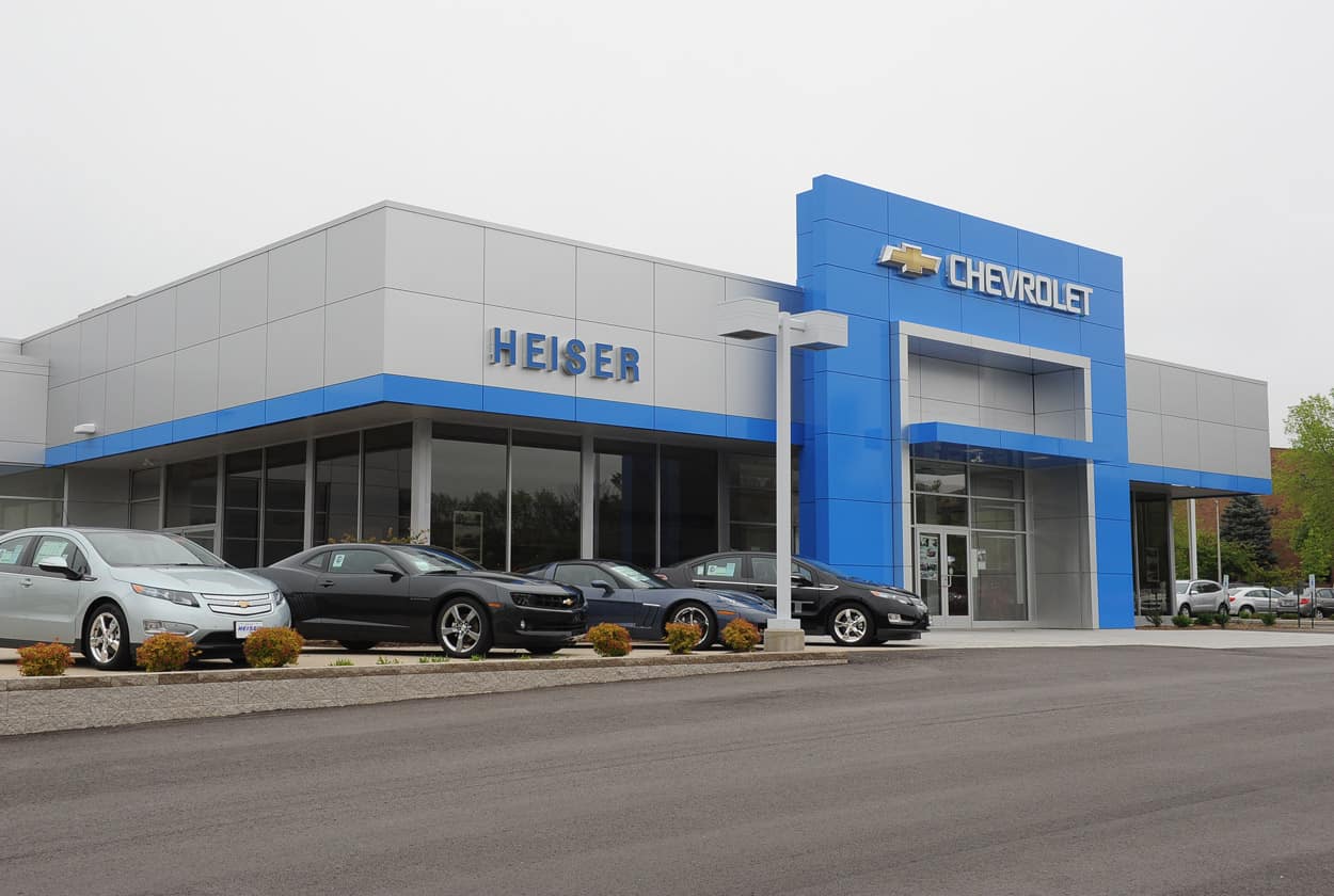 An exterior shot of a Chevrolet dealership during the day.