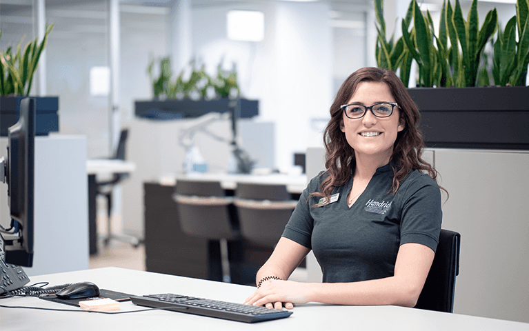 Woman smiling at her desk