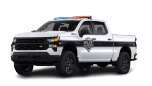 White Chevy Silverado 1500 police vehicle angled right