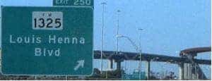 Louis Henna Blvd street sign