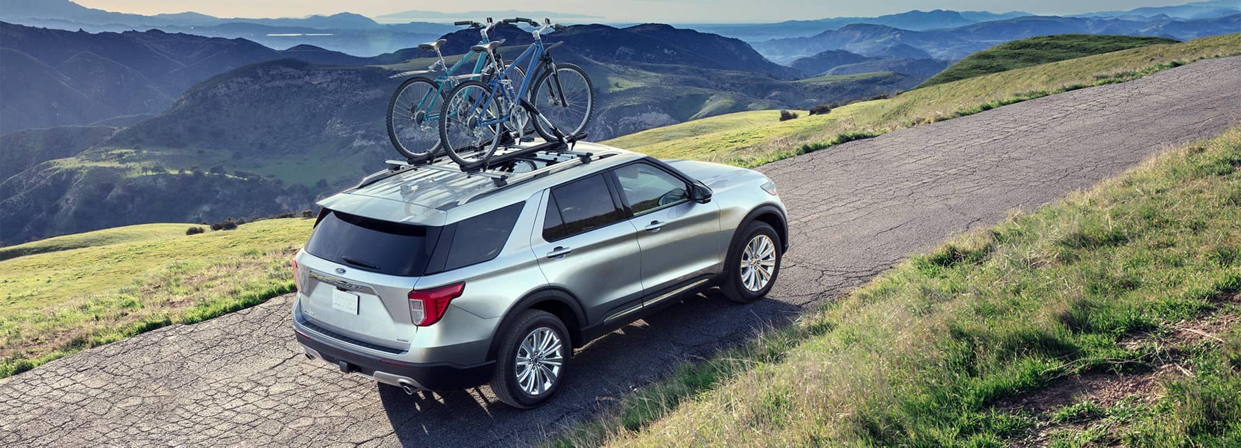 Silver 2022 Ford Explorer on a mountain road