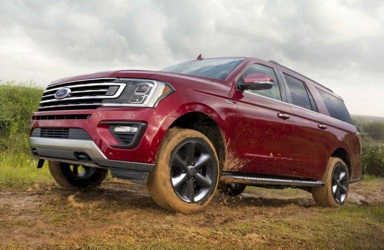 2019 Ford Expedition red mud side view