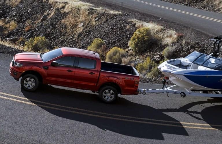 2019 Ford Ranger red side view towing a boat