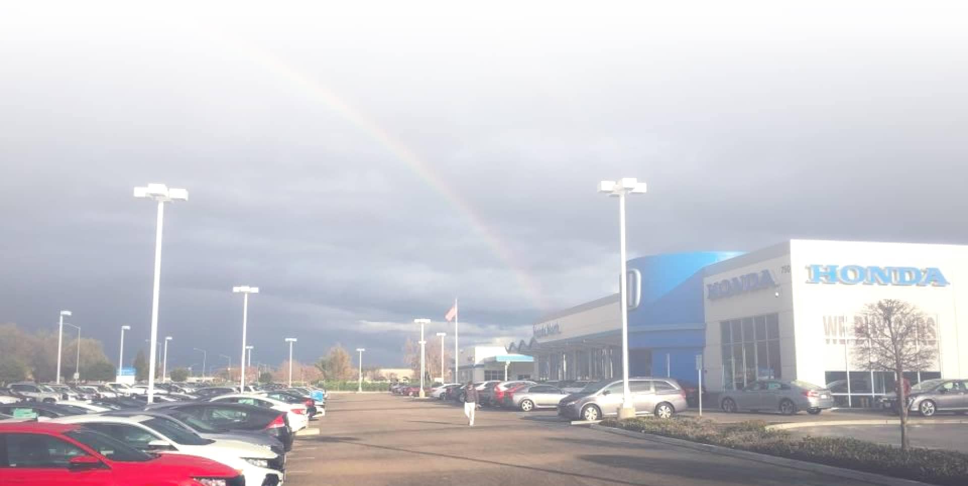 Honda North dealership with a rainbow in the sky