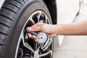 Checking Tire Pressure with Gauge