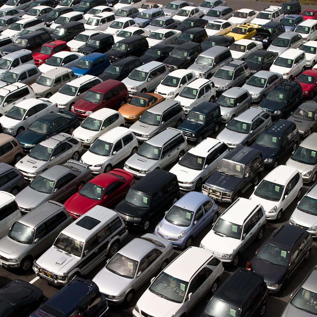 high view of many cars for sale in a lot