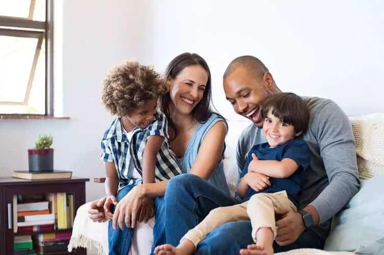 People Sitting On Couch With Kids