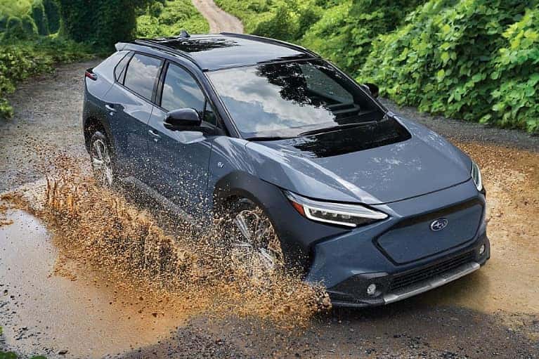 Subaru EV- driving through mud-grey-mobile