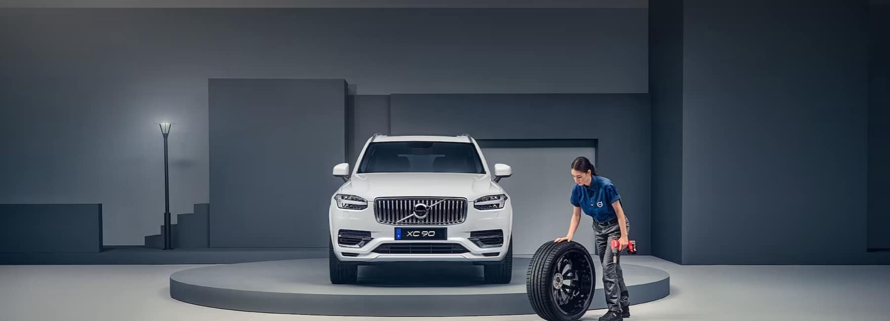 volvo-technician-rolls-tire-to-replace on XC90