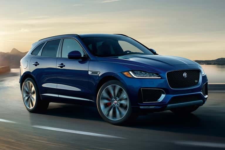 jaguar-suv-speeds-on-lakeside-highway
