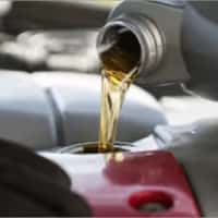 pouring oil in engine