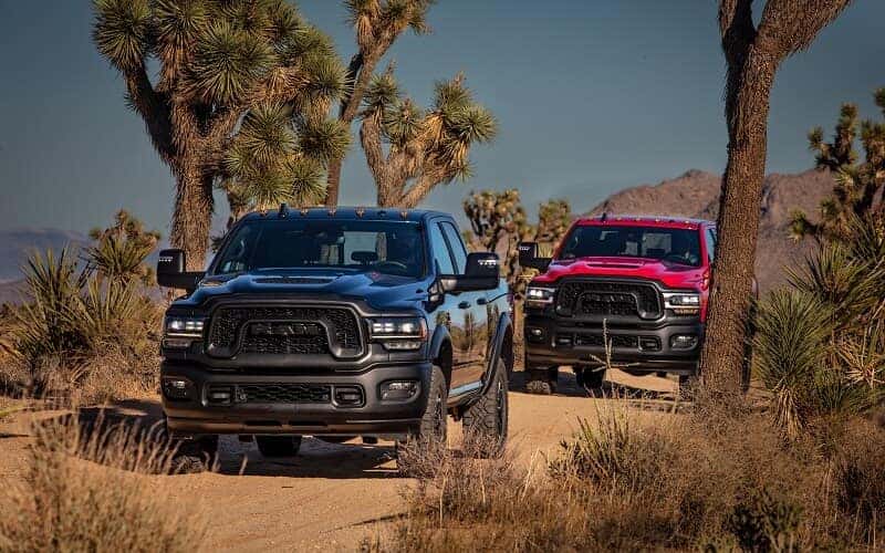 Ram Trucks Driving on Dirt Road