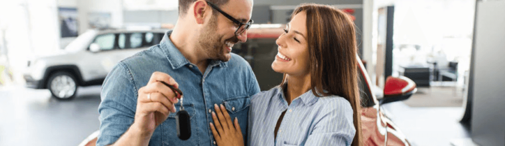 Couple holding car keys
