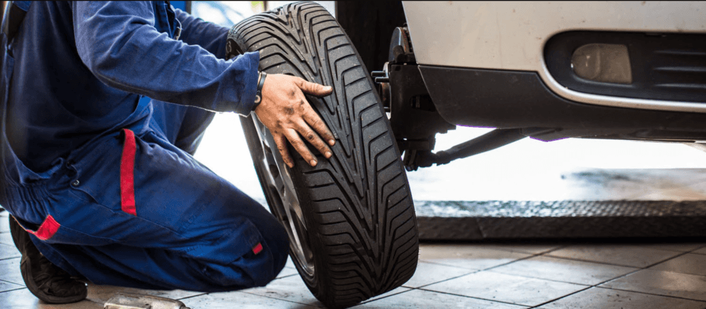 Service tech replacing tire