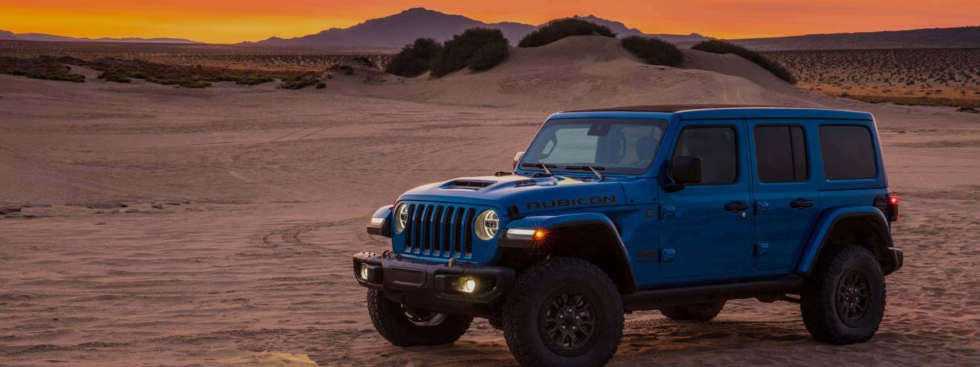 Blue Rubicon in desert 