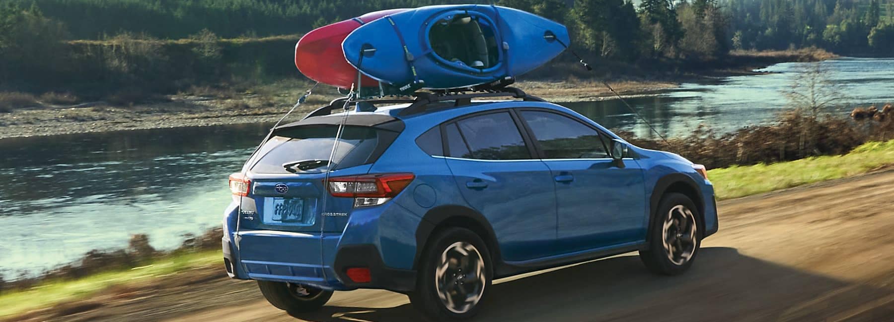 Crosstrek shown in Horizon Blue Pearl with kayaks