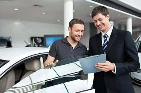 dealer_helping_customer