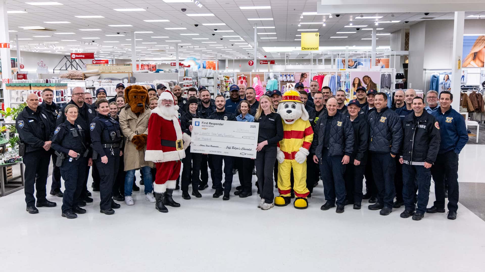 Jeff Belzer's Presents Lakeville Public Safety Foundation with Check at Shop With a Hero Event