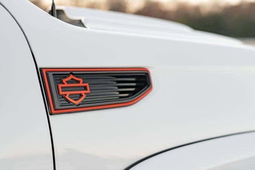 Harley-Davidson GMC Truck Logo on side of front hood of White truck