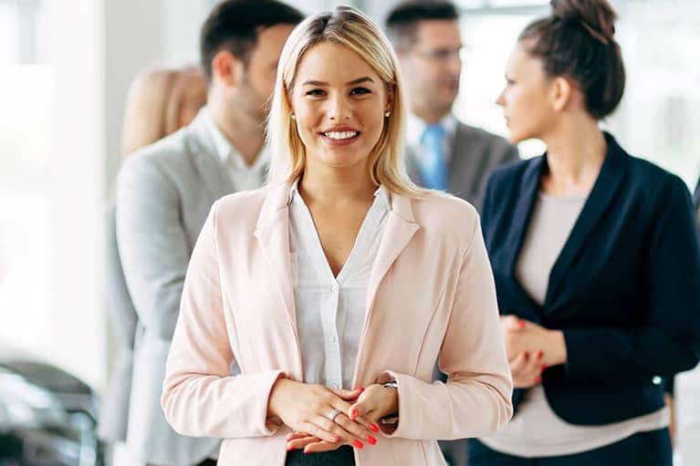 career professionals chatting together in showroom