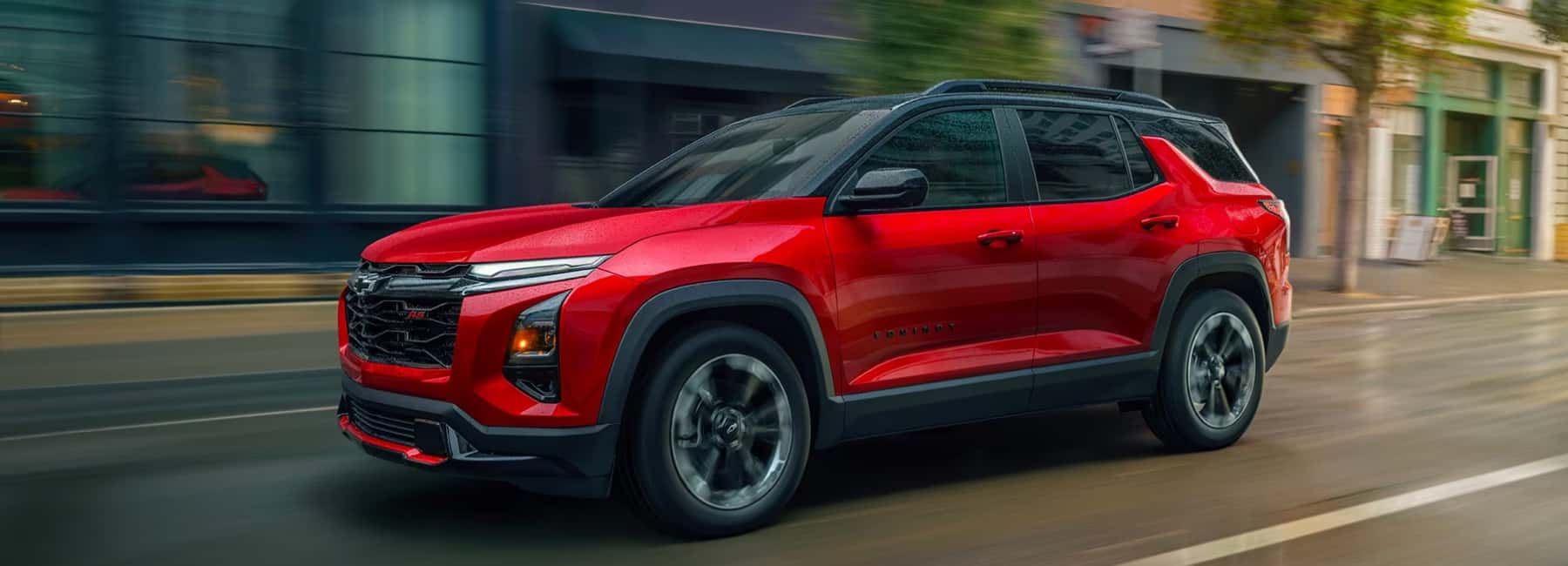 2026-red-Chevy-Equinox-speeds-on-city-street-mobile