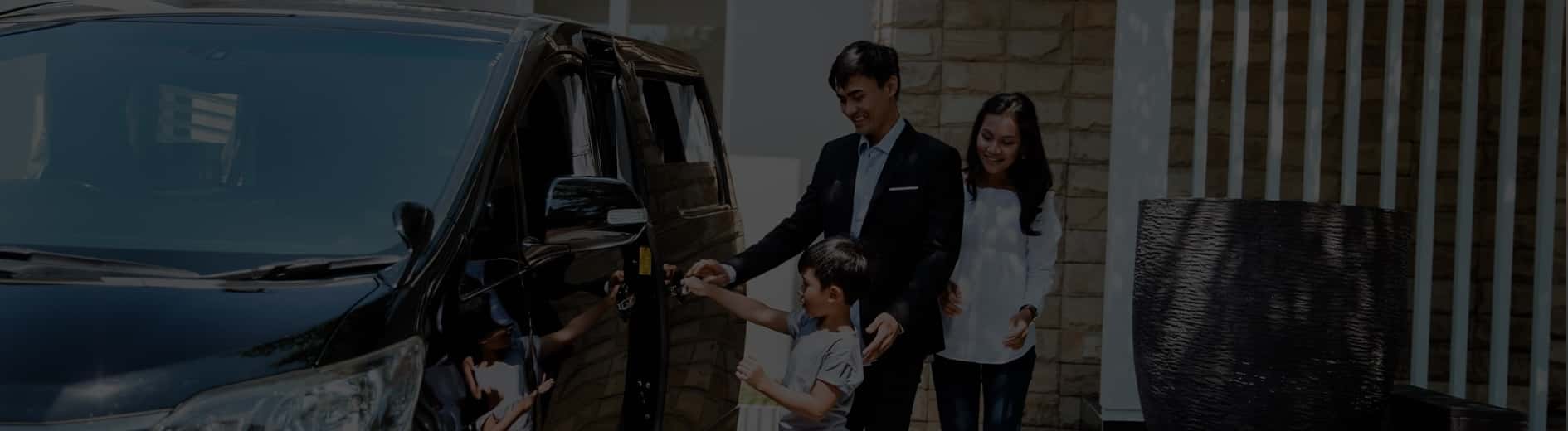 Happy family getting into a new car