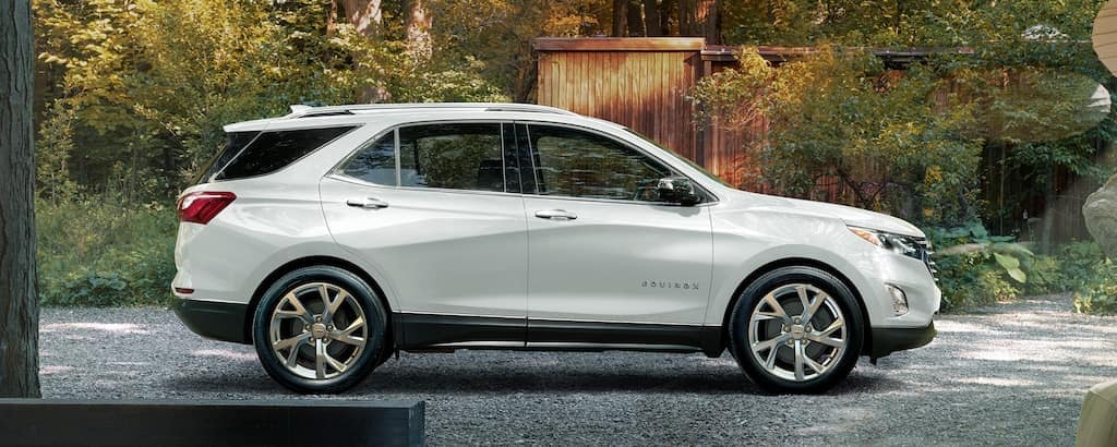 A white 2020 Chevy Equinox parked in a driveway