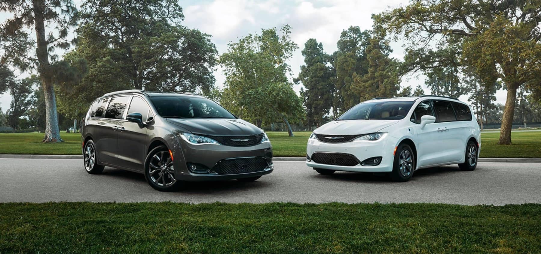 2020 Chrysler Pacificas parked in front of trees