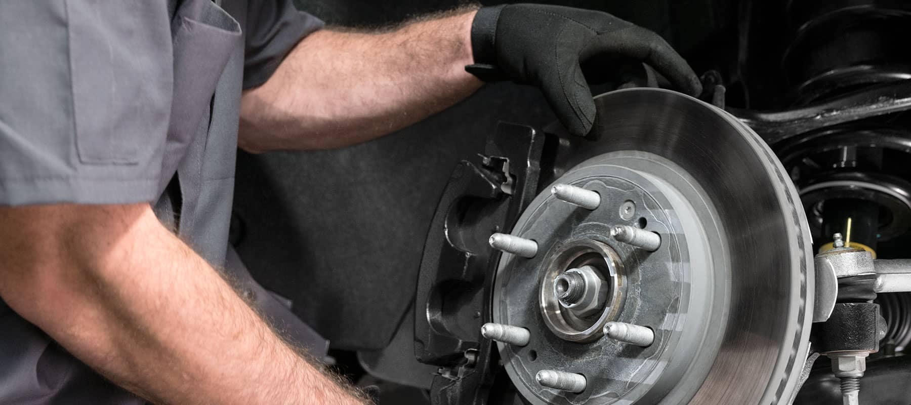 GM Service Technician Installing Brakes
