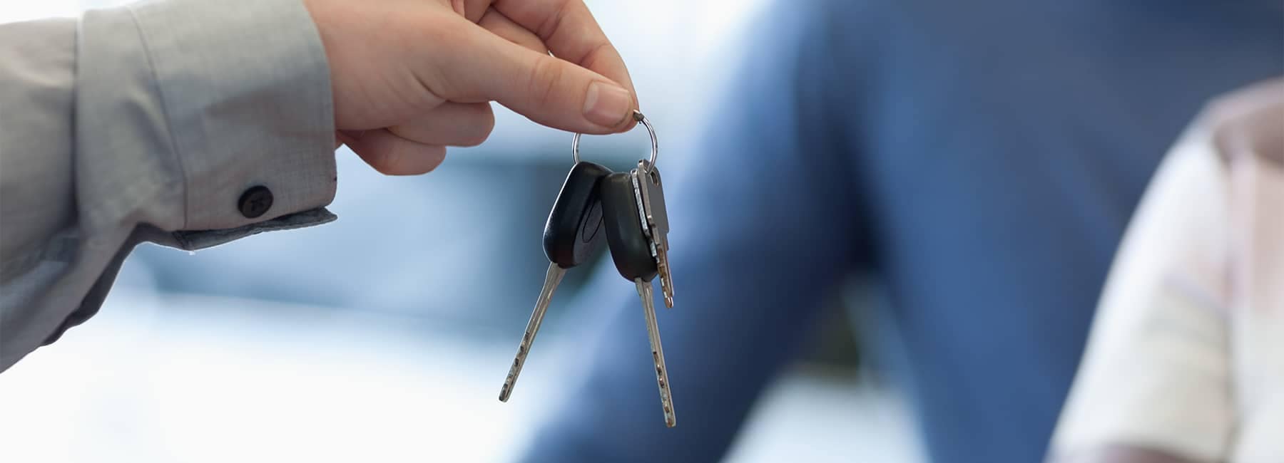 Salesman Handing Keys of New Chevrolet Car