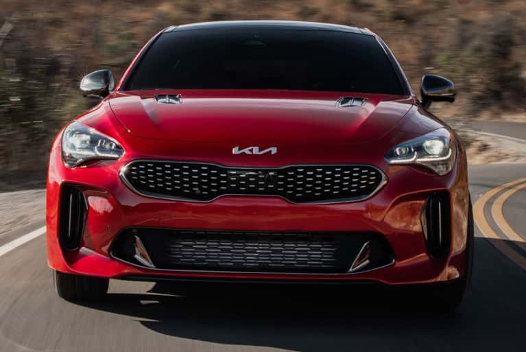 Red Kia Stinger on the road