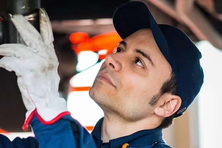 technician-repairs-car-in-service-bay-mobile