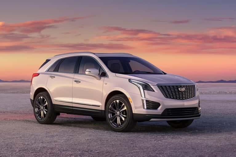 2025-CT5 parked on white gravel with colorful sunset