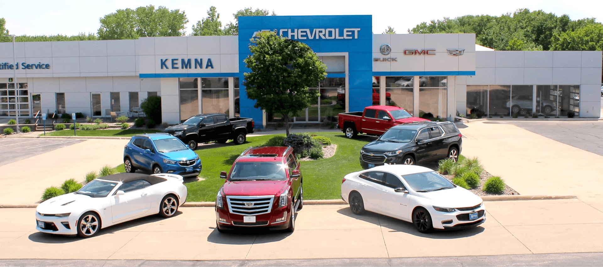 An exterior shot of a Chevrolet dealership during the day.