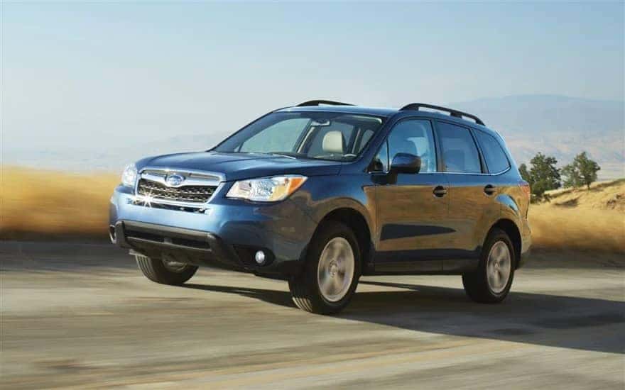 blue subaru on road